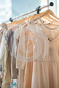 Dresses on a wooden hangers