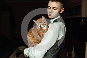 Dressing groom and preparing for ceremony on background