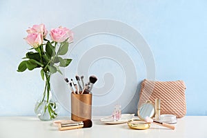 Dressing table with beauty accessories in room