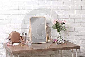 Dressing table with different makeup products and accessories