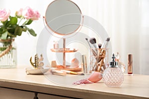 Dressing table with different makeup products and accessories