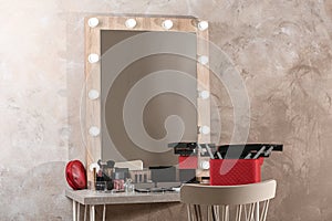 Dressing table with different makeup products and accessories