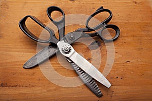 Dressmaker shears and Pinking shears tailor/craft concept on wo