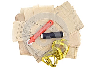 Dressmaking, sewing equipment isolated on white. Paper pattern thread, marker etc.