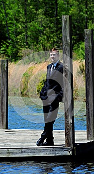Dressy Business Suit and Wooden Dock photo
