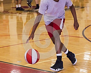 Dribbling a basketball indoors