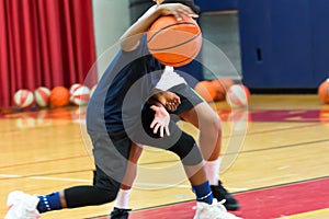 Dribbling a basketball at summer camp