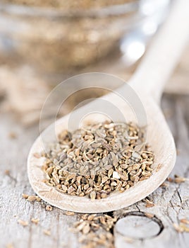 Dried Aniseed on a wooden spoon