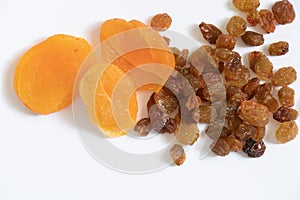 Dried apricot and raisins on isolated white background close -up