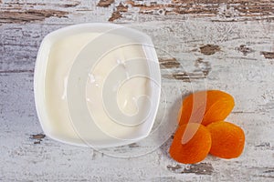 Dried apricot and yogurt in bowl, increase metabolism