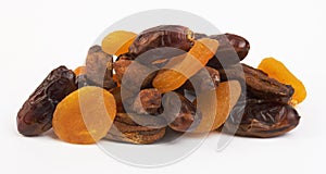 Dried apricots, dates and bananas on white