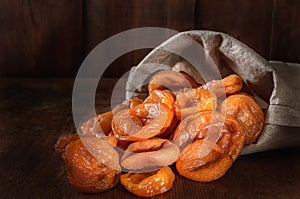 Dried apricots in a woven bag