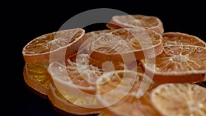 Dried assorted citrus on black background spin or rotate.