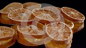 Dried assorted citrus on black background spin or rotate.