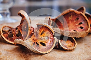 Dried bael on wood plate