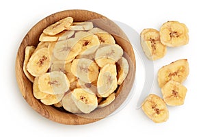 Dried banana chips in wooden bowl isolated on white background with full depth of field. Top view. Flat lay