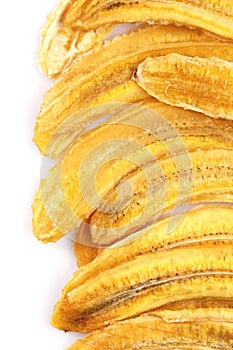 Dried banana slices. Sliced dried banana isolated on white background. Sun-dried fruit. close up