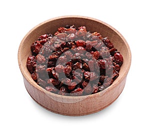 Dried barberries in wooden bowl isolated