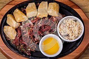 Dried beef with cassava, traditional Brazilian food. top view photo