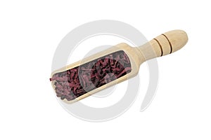 Dried beetroot slices in wooden scoop isolated on white background. in wooden scoop isolated on white background.