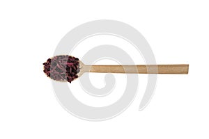 Dried beetroot slices on wooden spoon isolated on white background