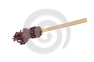 Dried beetroot slices on wooden spoon isolated on white background