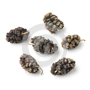 Dried black mulberries close up photo