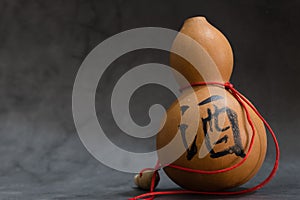 Dried bottle gourd on black background view,the chinese means is wine