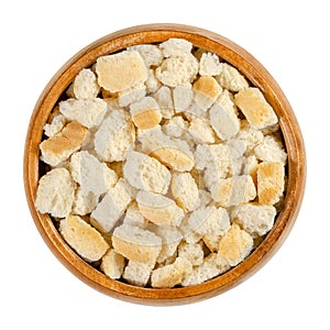 Dry bread cubes for stuffing in a wooden bowl photo