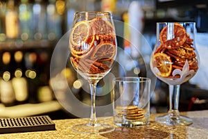 Dried candied orange wheels in large glass container