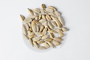 Dried cardamom seeds isolated on white