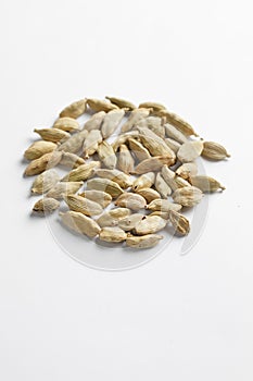 Dried cardamom seeds isolated on white