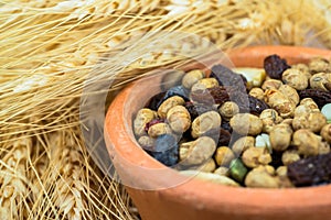 Dried cereal seeds and fruits with stalks of wheat ears