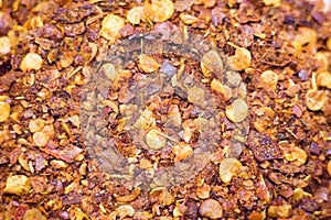 Dried chili flakes and seeds isolated on white background.