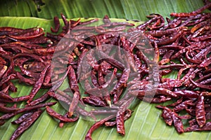 Dried chilli on banana leaf for show and sale