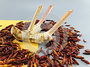 Dried chillies surrounded by fresh galangal