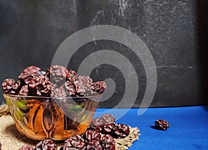 Dried chinese jujubes fruits ,chinese herbal medicine on bowl .