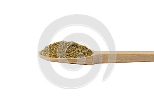 dried common chamomile flowers in latin - Matricaria chamomilla on wooden spoon isolated on white background. Medicinal herb