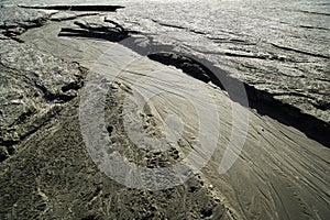 Dried creek with a pattern on the sand