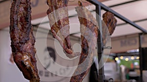 Dried, Cured, Smoked Meat Weighs on a Hooks and is Sold in an Open Showcase. 4K