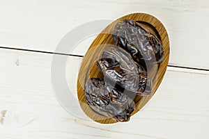 Dried date medjool on grey wood