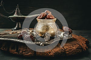 Dried date palm fruits or kurma, ramadan food. Beautiful bowl full of date fruits symbolizing Ramadan. Copy space