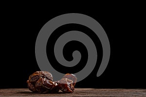 Dried date palm on wooden floor.