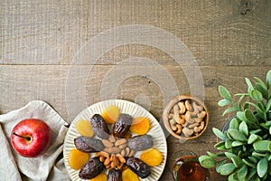 Dried dates, fruits and nuts for Jewish holiday Tu Bishvat celebration. Top view background