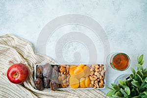 Dried dates, fruits and nuts for Jewish holiday Tu Bishvat celebration. Top view modern background