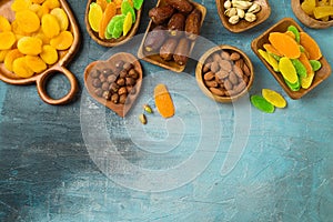 Dried dates, fruits and nuts on rustic background. tu bishvat holiday concept. Top view, flat lay