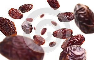 Dried dates levitate on a white background