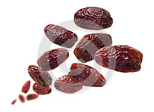 Dried dates levitate on a white background