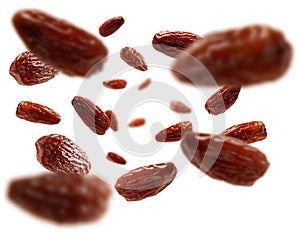 Dried dates levitate on a white background