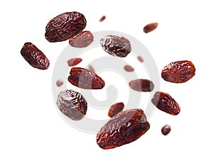 Dried dates levitate on a white background